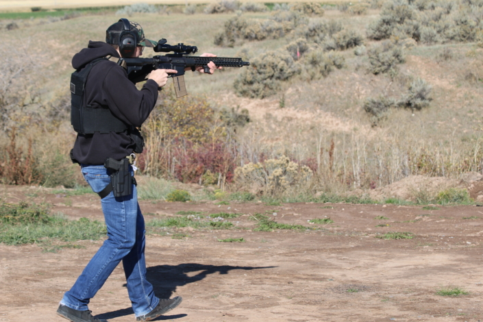 Man walking with rifle