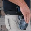 Man Wearing Dominate Defense Combo Belt with Firearm