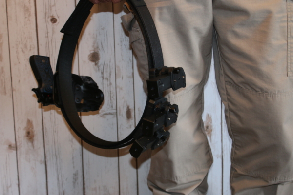 Man Holding Dominate Defense Combo Belt